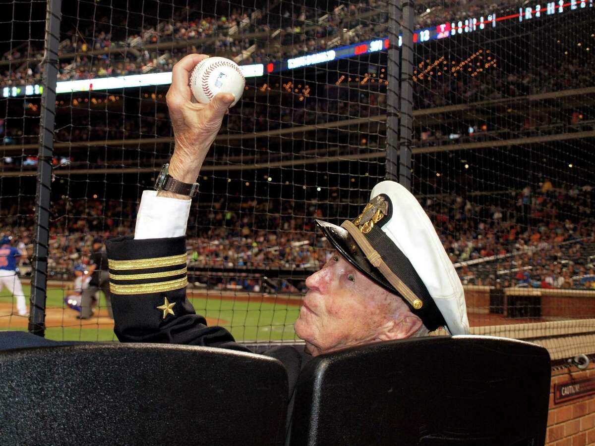 Standard displays a ball that was flipped over the screen to him by the Texas Ranger batboy during the July 4 matchup between the Mets and the Rangers at Citi Field. "He caught it backhand," says Tom Healey, a friend of Standard's and a fellow member of the Greenwich Retired Mens Association.