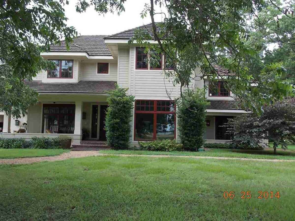 Relax in this waterfront Beaumont home with dock