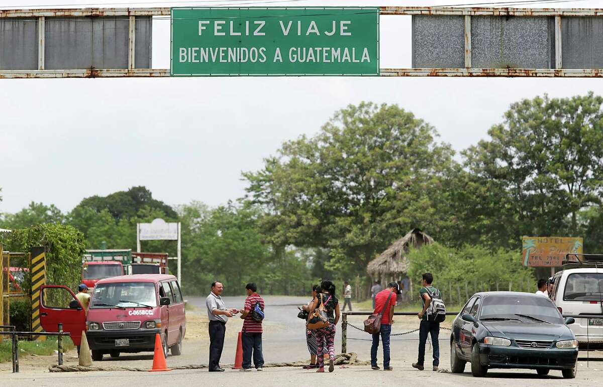 Young travelers cross the border into Guatemals at Corinto, Honduras, however the one in the red shirt at right, Luis Hernandez, was turned away for being underage. Friday, June 27, 2014.