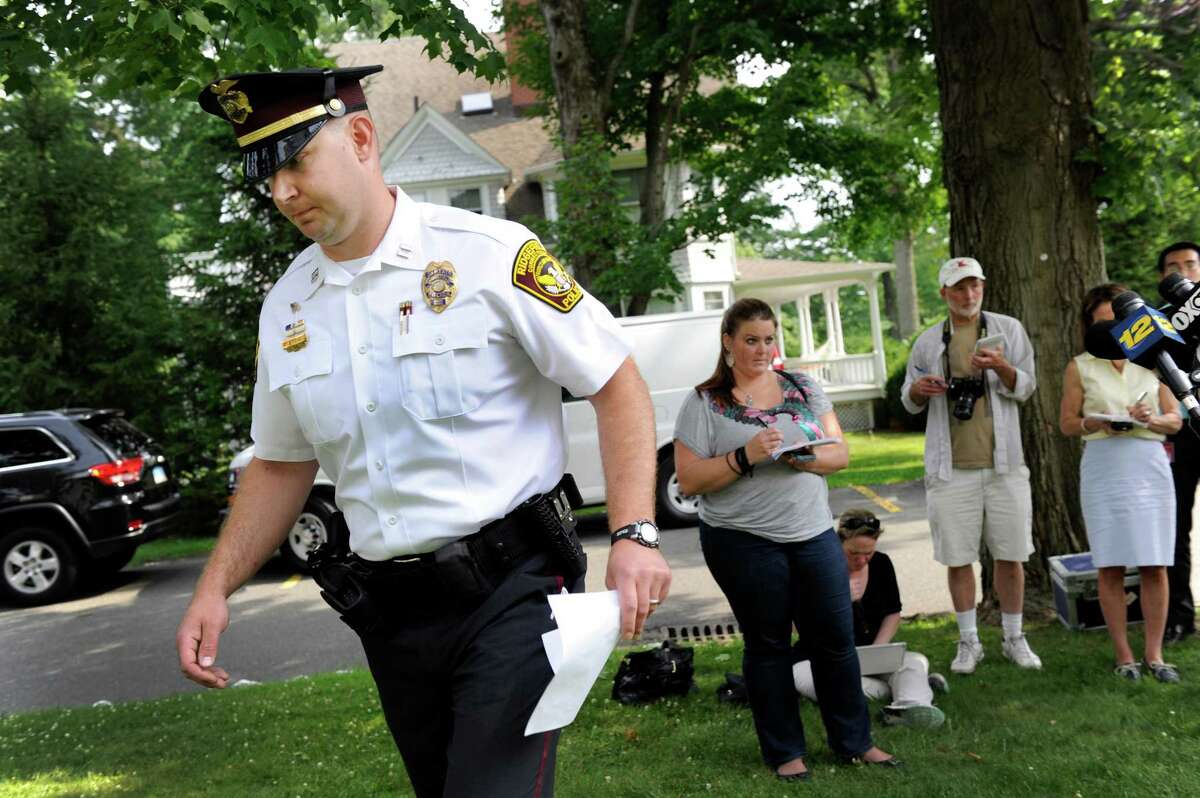 Captain Jeff Kreitz, public information officer with the Ridgefield Police Dept., ends a press conference regarding the death of a child left in a hot car, refusing to take questions from the media, Tuesday, July 8, 2014 in Ridgefield, Conn.