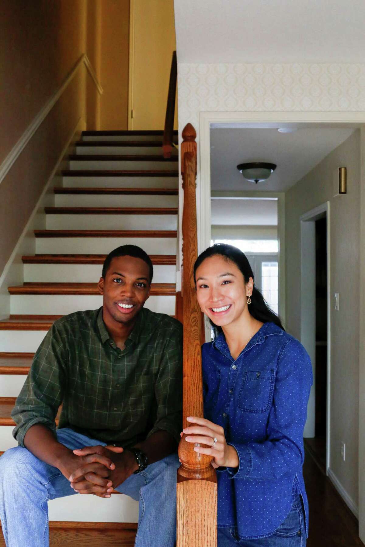 Newlyweds Esther and Brandon Hendricks in their town home June 28, 2014 in Houston.