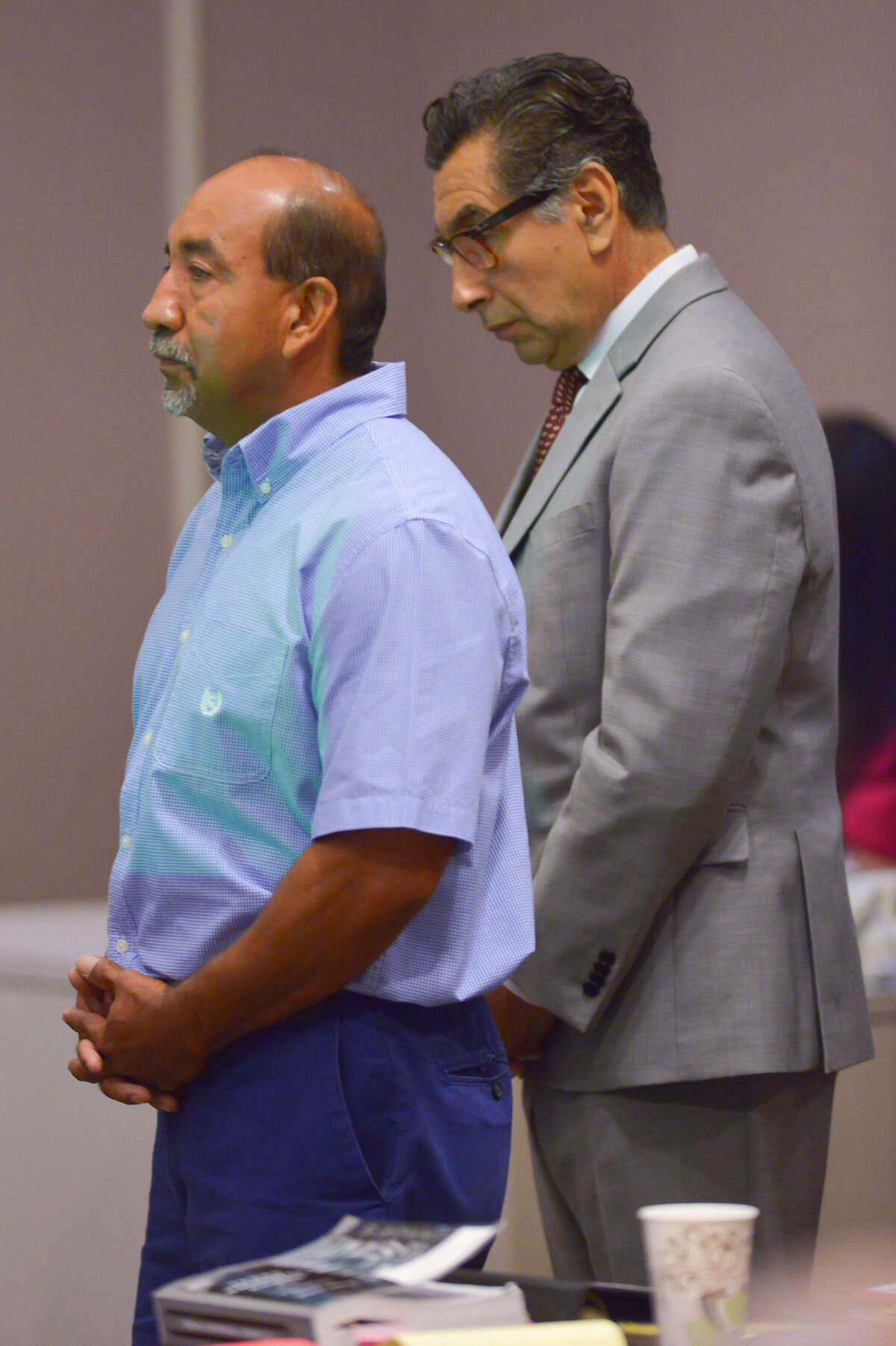 Adrian Perryman (left) stands with his attorney Tony Jimenez at the start of his trial.