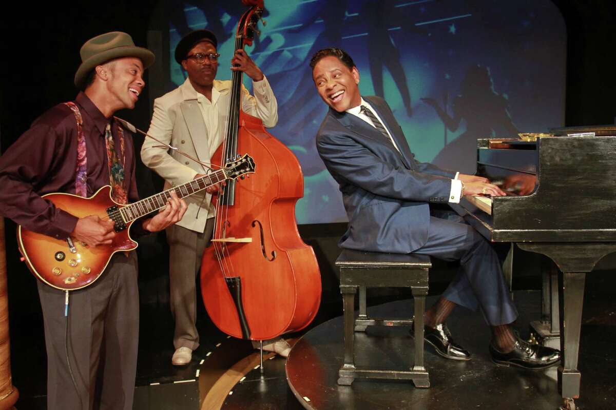 Derrick Brent II, from left, Jason Carmichael and Dennis Spears, as Nat King Cole, star in the Ensemble Theatre's production of "I Wish You Love," about troubles famed singer Nat King Cole faced in 1957 when he starred in his own TV music/variety show.