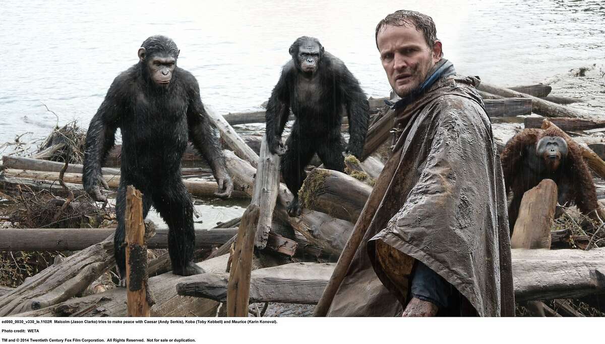 DAWN OF THE PLANET OF THE APES Malcolm (Jason Clarke) tries to make peace with Caesar (Andy Serkis), Koba (Toby Kebbell) and Maurice (Karin Konoval).
