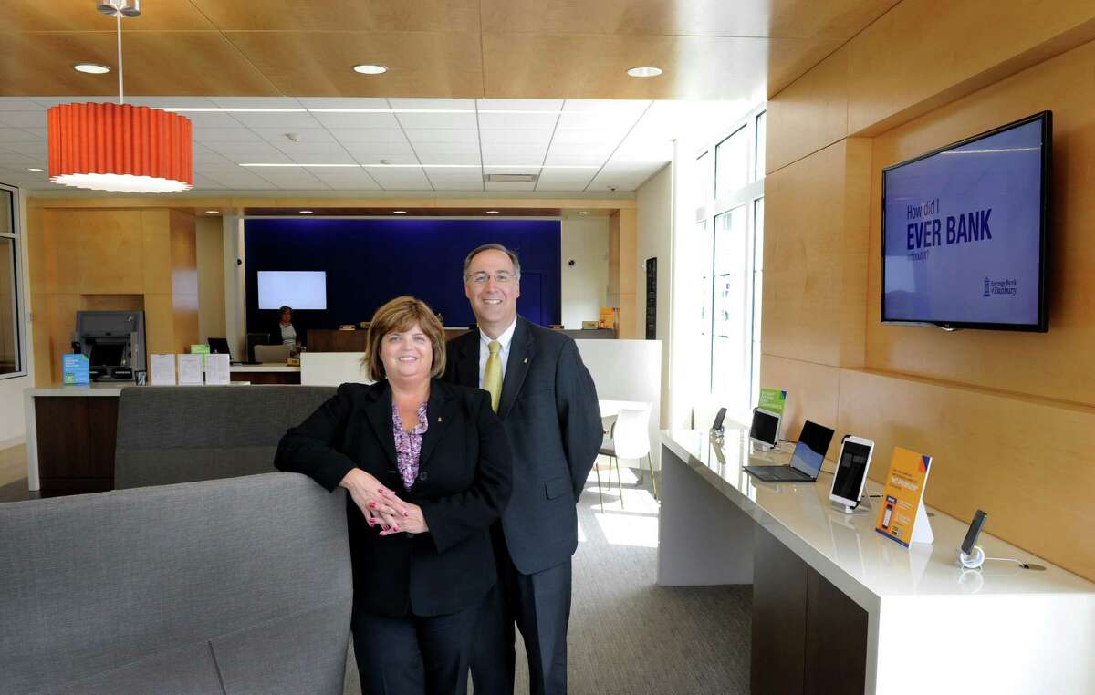 Kathleen Romagnano, 51, president and chief executive officer of Savings Bank of Danbury and Steven Cacchio, 50, executive vice president and chief operating officer, are photographed in the new branch office of Savings Bank of Danbury, 314 Danbury Road in New Milford, Conn., Wednesday, July 9, 2014.