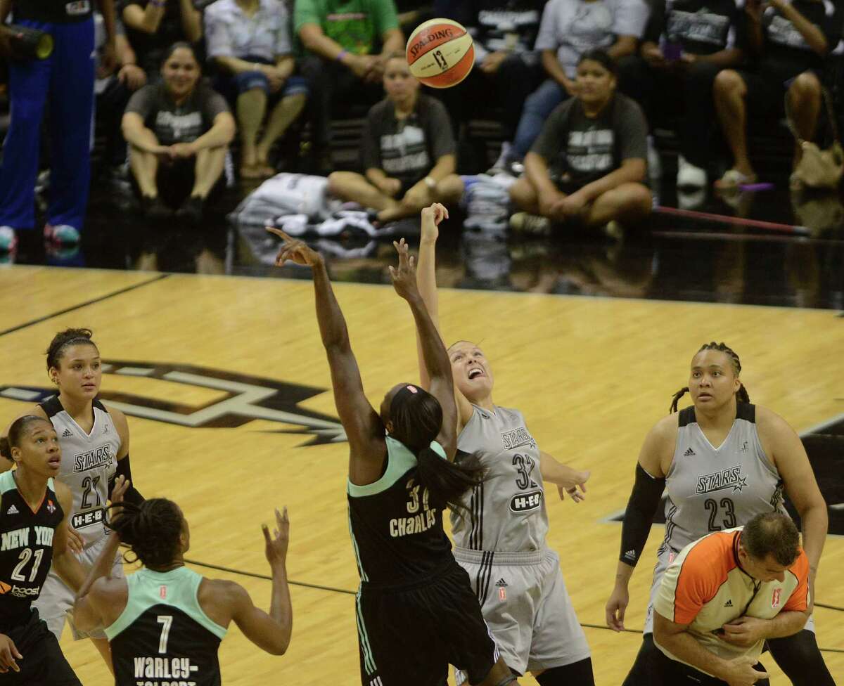 Tina Charles (31) of the New York Liberty and Jayne Appel of the San Antonio Stars compete for a jump ball to start their WNBA game in the AT&T Center on Wednesday, July 9, 2014.