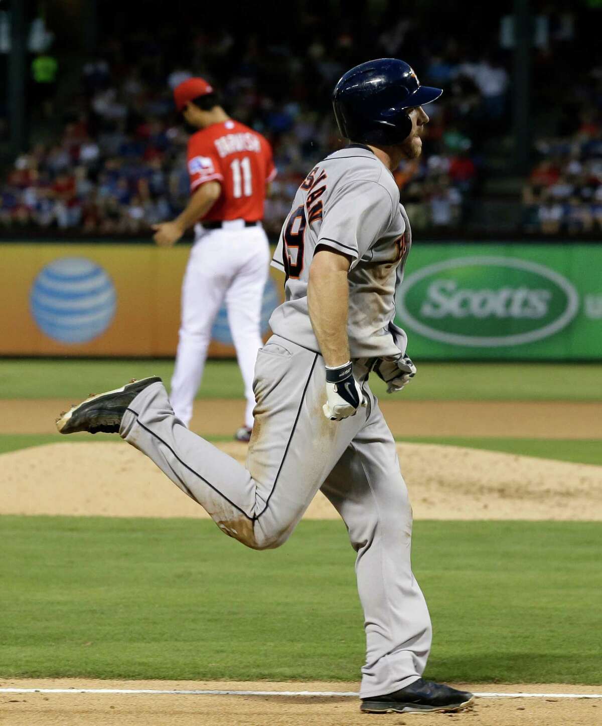 Robbie Grossman enjoys a leisurely stroll around the bases after launching a solo homer off Rangers ace Yu Darvish, rear, in the fifth.