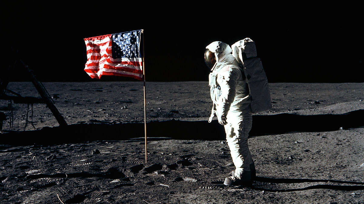 Astronaut Buzz Aldrin, lunar module pilot of the first lunar landing mission, poses for a photograph beside the deployed United States flag during Apollo 11 on July 20, 1969. Astronaut Neil Armstrong took the photograph.