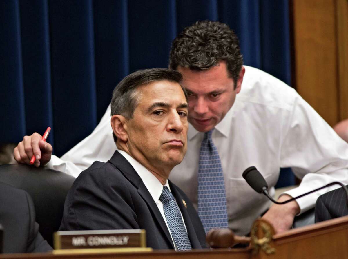 FILE - This May 8, 2013, file photo shows House Oversight Committee Chairman Rep. Darrell Issa, R-Calif., left, confering with Rep. Jason Chaffetz, R-Utah, right, on Capitol Hill in Washington, during a House Oversight Committee hearing about the deadly assault on the U.S. diplomatic mission in Benghazi, Libya. The testimony of nine military officers severely undermines claims by Republican lawmakers that a âstand-down orderâ held back military assets who could have saved the U.S. ambassador and three other Americans killed during the assult. (AP Photo/J. Scott Applewhite, File)