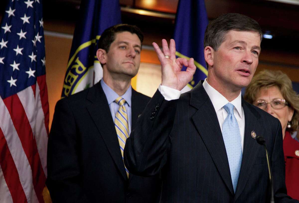 House Budget Chairman Rep. Paul Ryan, R-Wis. watches at left as Republican Conference Chairman Rep. Jeb Hensarling, R-Texas gestures during a news conference on the GOP budget, on Capitol Hill in Washington Thursday, March 29, 2012.