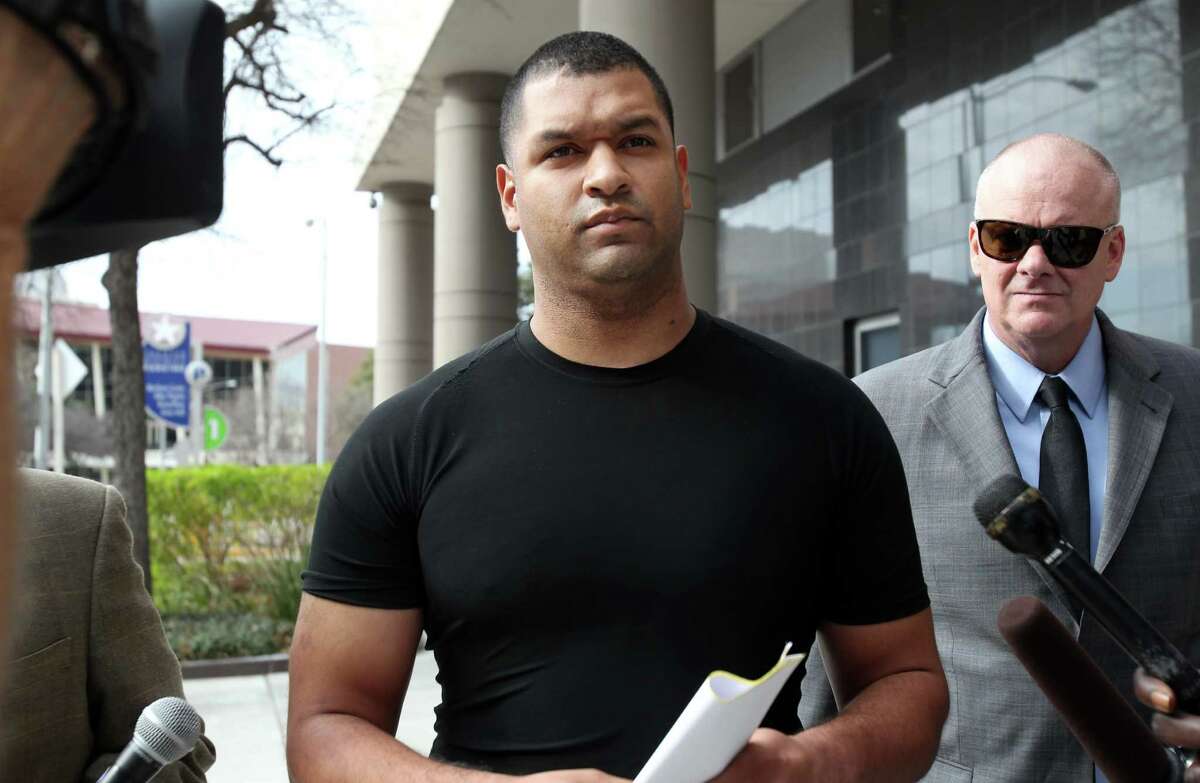 Emerson Canizales, 26, of Kingwood, walks out of the Bob Casey Federal Courthouse on Monday, Jan. 28, 2013, in Houston. Houston Police Officer Canizales and fellow officer Michael Miceli, 26, of Humble, were arrested on drug charges as they reported to work on Sunday. They were charged with conspiracy to violate teh Hobbs Act as well as conspiracy to possess a controlled substance. ( Mayra Beltran / Houston Chronicle )