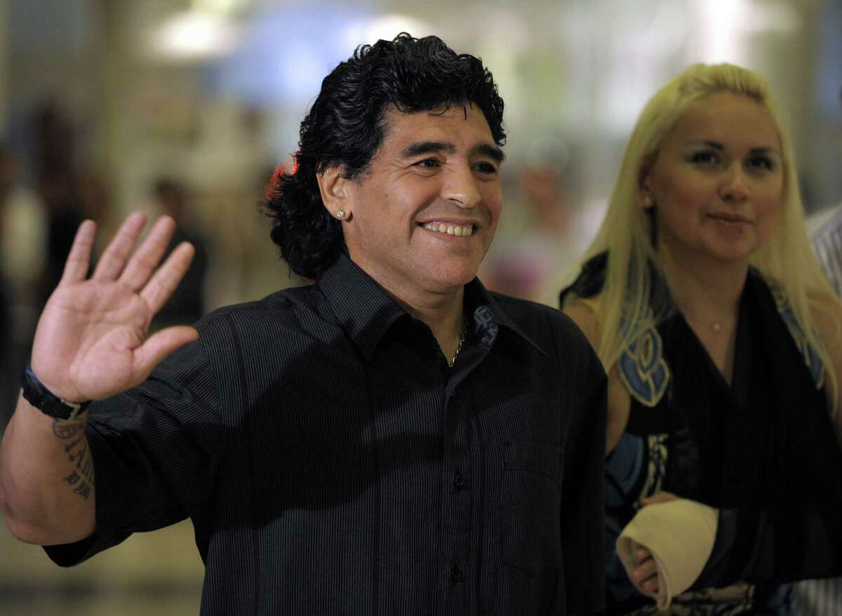 (FILE) Argentine football legend Diego Maradona and girlfriend Veronica Ojeda arrive for the opening of a mall in Canning, on the outskirts of Buenos Aires, on December 18, 2008. Ojeda told Argentine website Ciudad.com on September 21, 2012 that the former star and current Honorary Ambassador of Sports in Dubai will have a new son, for she is four months pregnant. Maradona has two daughters from his marriage to Claudia VillafaÃ©±e, Dalma and Giannina, and a son named Diego from an extramarital relationship with Italian Claudia Singara. AFP PHOTO/JUAN MABROMATAJUAN MABROMATA/AFP/GettyImages