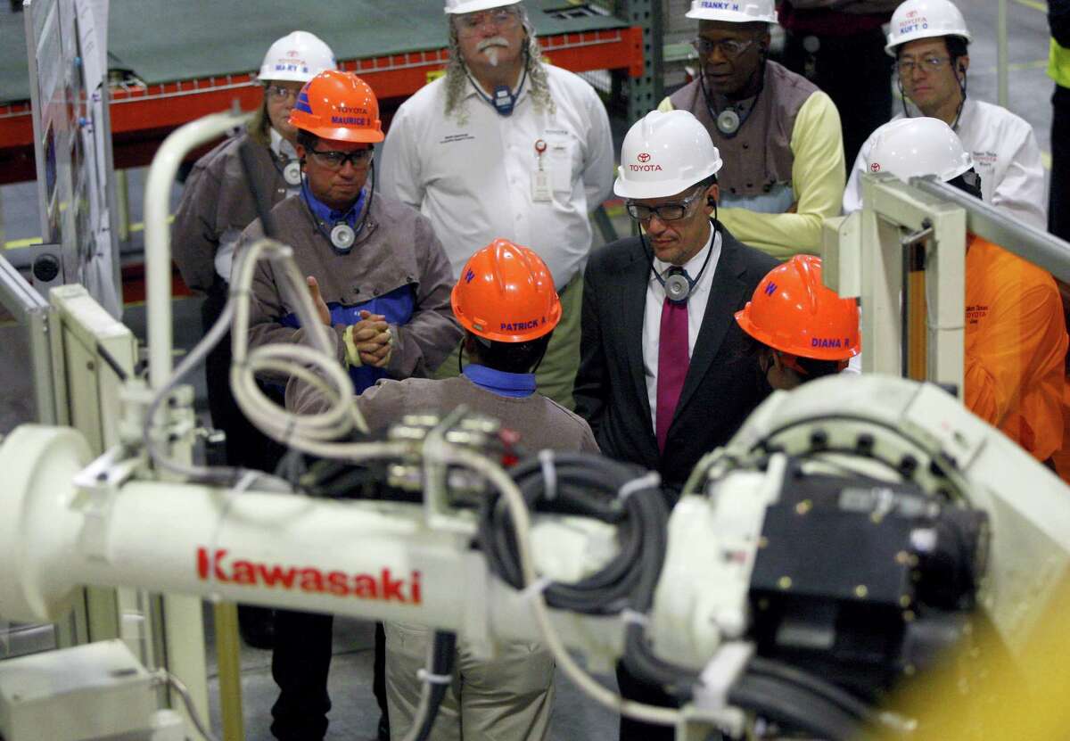U.S. Secretary of Labor Thomas Perez (center, wearing suit) visits the plant, where students from the Alamo Colleges Workforce Center of Excellence describe their work at Toyota Motor Manufacturing Texas.