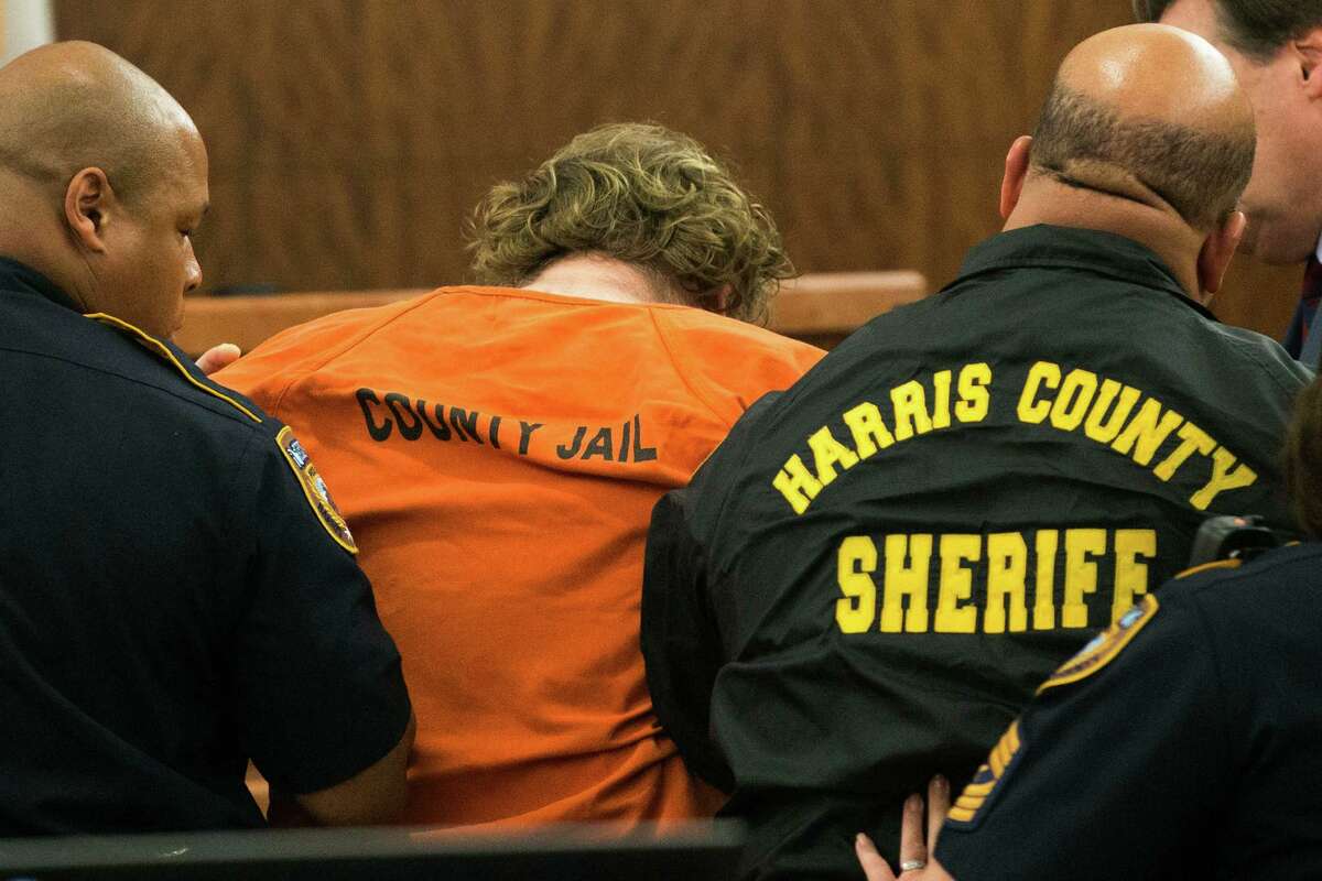 Accused mass shooter Ron Lee Haskell collapses as he appears in court on Friday, July 11, 2014, in Houston. Haskell is accused of a mass shooting that resulted in the death of six people.