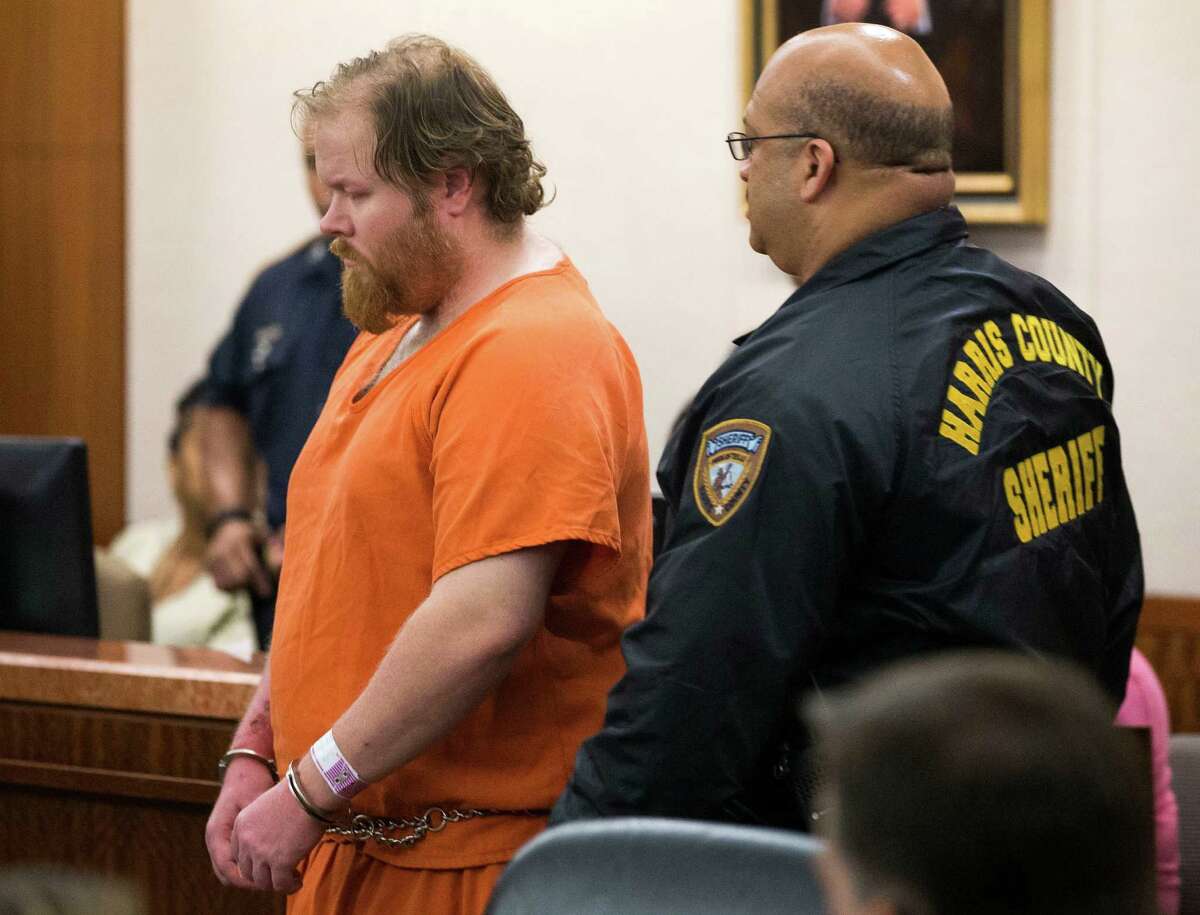 Accused mass shooter Ron Lee Haskell is escorted by deputies for a hearing on Friday, July 11, 2014, in Houston. Haskell is accused of a mass shooting that resulted in the death of six people.
