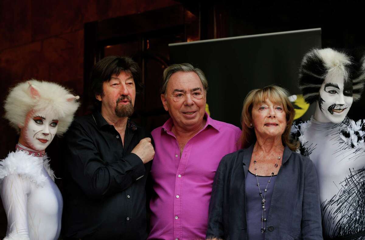 British composer Andrew Lloyd Webber, centre, director Trevor Nunn, centre left, and choreographer Gillian Lynne, centre right, pose for the photographers with performers in cat costumes, during a photo-op to promote the return of the musical Cats, in central London, Monday, July 7, 2014. The show, based on T.S Eliot's 'Old Possum's Book of Practical Cats', will return to the West End for a limited 12-week run from Dec, 2014. Cats, one of the longest-running shows in West End and on Broadway, received its world premiere in London in 1981 where it played for 21 record-breaking years and almost 9,000 performances. According to its creators Cats has been presented in over 26 countries, has been translated into 10 languages and has been seen by over 50 million people world-wide. (AP Photo/Lefteris Pitarakis)