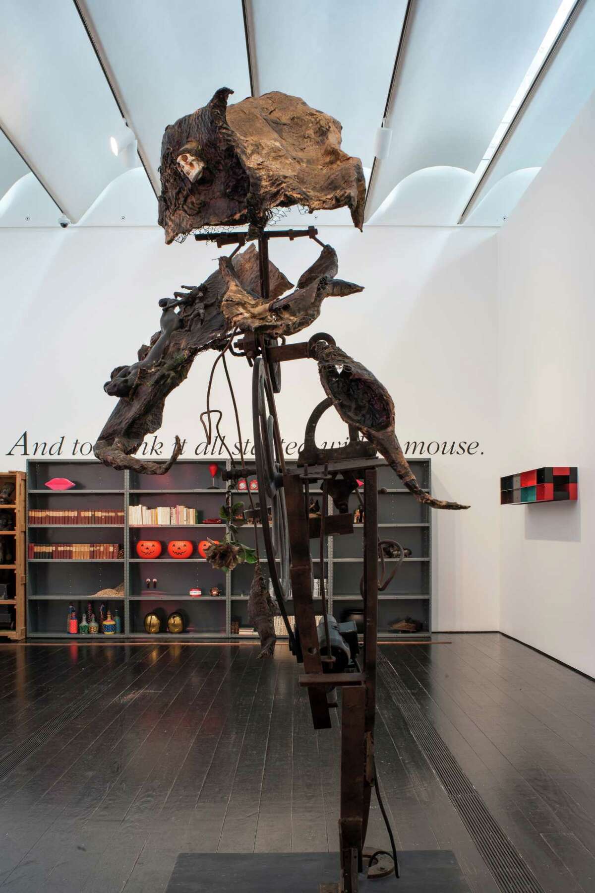 A gallery about the way humans store art and ideas includes a Display of many seemingly unrelated objects and the sculpture "M.O.N.S.T.R.E." by Niki de Saint Phalle and Jean Tinguely in the exhibition "fresh: Haim Steinbach and Objects from the Menil Collection," on view through Aug. 31.