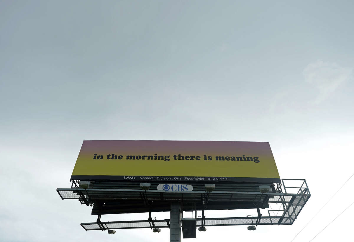 A billboard on the south side of Ford Park along Interstate 10 reads "in the morning there is meaning" on Tuesday afternoon. Artist Eve Fowler, as part of the Los Angeles Nomadic Division's Manifest Destiny Billboard Project, has placed three billboard messages between Beaumont and Winnie on Interstate 10. In addition, a "lending library" with books relating to the quotations has been installed at the M&D Supply on College Street. Photo taken Tuesday 7/8/14 Jake Daniels/@JakeD_in_SETX
