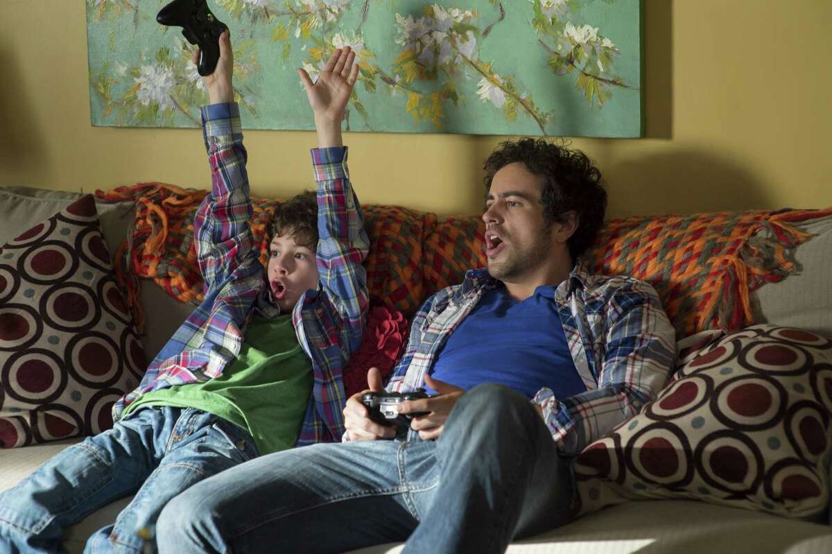 Billy (William Ainscough, left) connects with biological dad Harry (Adam Korson) in the CW comedy "Seed."