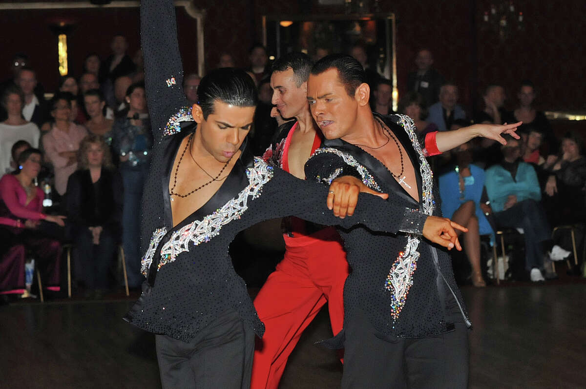 Sergio Brilhante, left, and Jonathan Morrison take part in a ballroom dancing competition. A proposed rule change in England would ban same-sex couples.