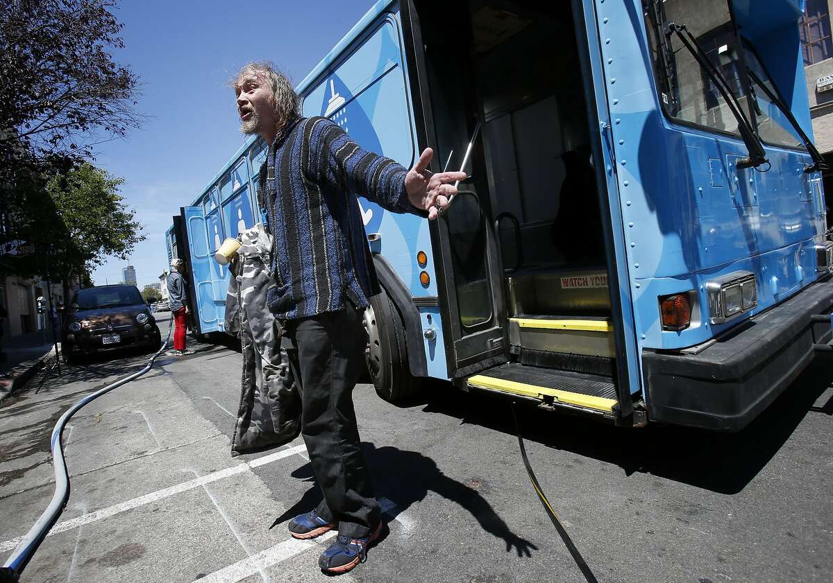 Silas Borden, a homeless man, emerged from the Lava Mae bus with a smile on his face thankful for a shower Tuesday June 24, 2014 in San Francisco, Calif. Lava Mae, the program that is turning old MUNI buses into showers for homeless people. began their test run in front of the Mission Neighborhood Resource Center.
