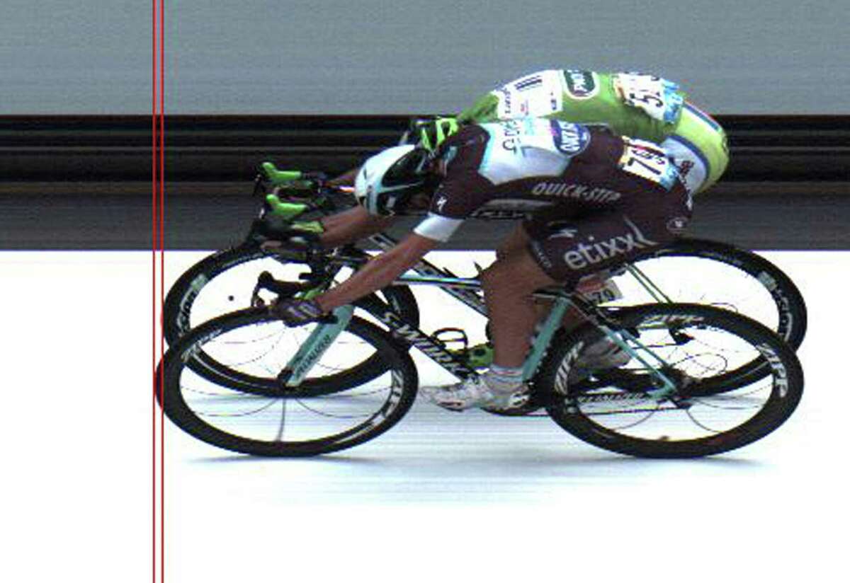 Italy's Matteo Trentin, front, barely beats Slovakia's Peter Sagan across the finish line to win the seventh stage of the Tour de France on Friday.