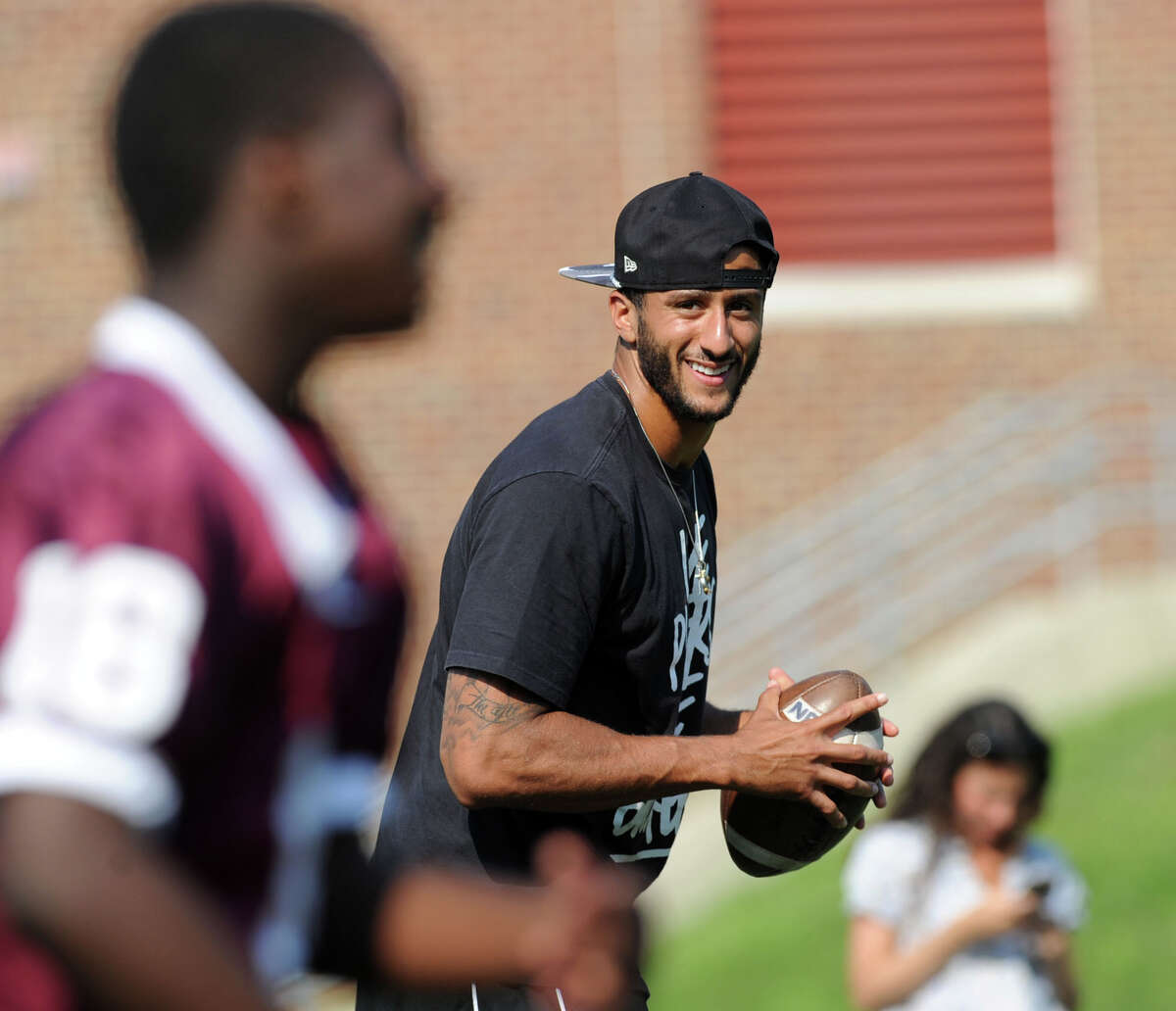 San Francisco 49ers quarterback Colin Kaepernick during his visit to the St. Luke's School in New Canaan, Conn., Saturday afternoon, July 12, 2014. Kaepernick visited the school on behalf of the Children of Fallen Patriots Foundation that provides college scholarships and educational counseling to military children who have lost a parent in the line of duty. The foundation was founded by husband and wife, David and Cynthia Kim of Greenwich.