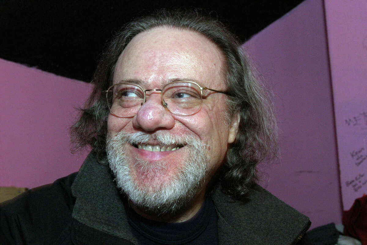 FILE - In this Jan. 8, 2005, file photo, Tommy Ramone, ex-drummer and manager of The Ramones, smiles as he is interviewed backstage at the Knitting Factory in New York. A business associate says Ramone, a co-founder of the seminal punk band The Ramones and the last surviving member of the original group, has died. Dave Frey, who works for Ramones Productions and Silent Partner Management, says Ramone's wife called to tell him he died on Friday, July 11, 2014. Ramone was 62. (AP Photo/Tina Fineberg, File)