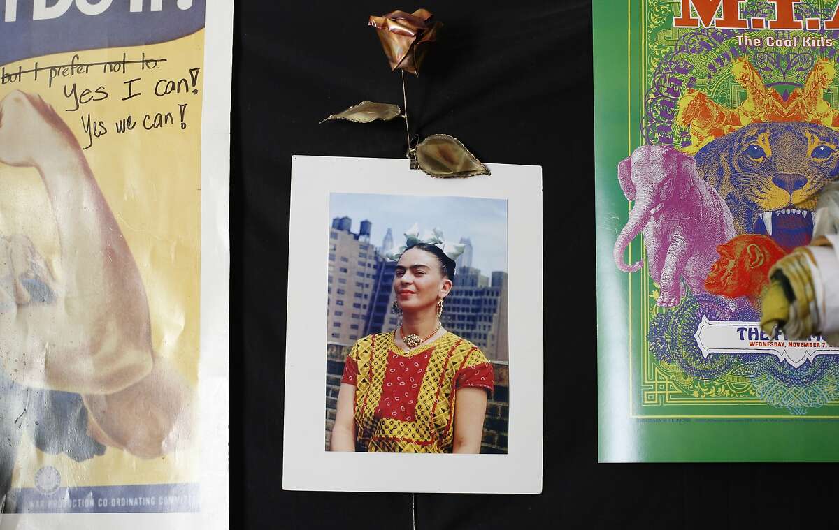 A photograph of Frida Kahlo hangs on Jean Franco Pilas' wall in his San Francisco home.
