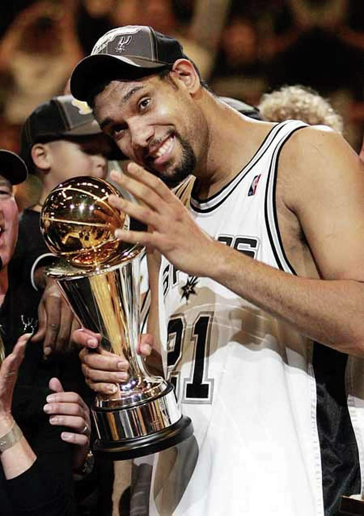 San Antonio Spurs' Tim Duncan celebrates as he was named the MVP of the NBA Finals. San Antonio won, 81-74, to win the championship.in game seven of the NBA finals in San Antonio, Thursday, June 23, 2005. (AP Photo/Eric Gay