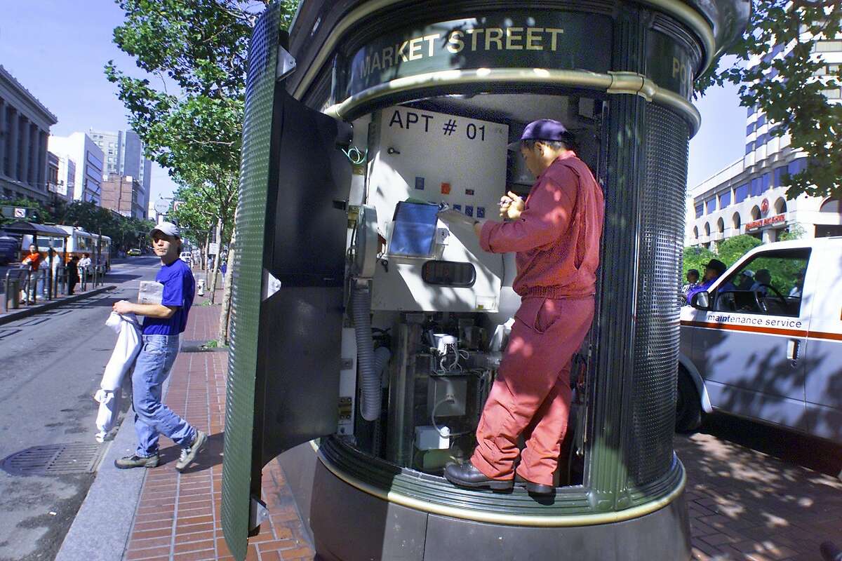 TOILETS3-C-03JUL01-MT-LH--JC DeCaux toilet located on Market at Powell streets being cleaned by maintenance worker. (BY LIZ HAFALIA/THE SAN FRANCISCO CHRONICLE)