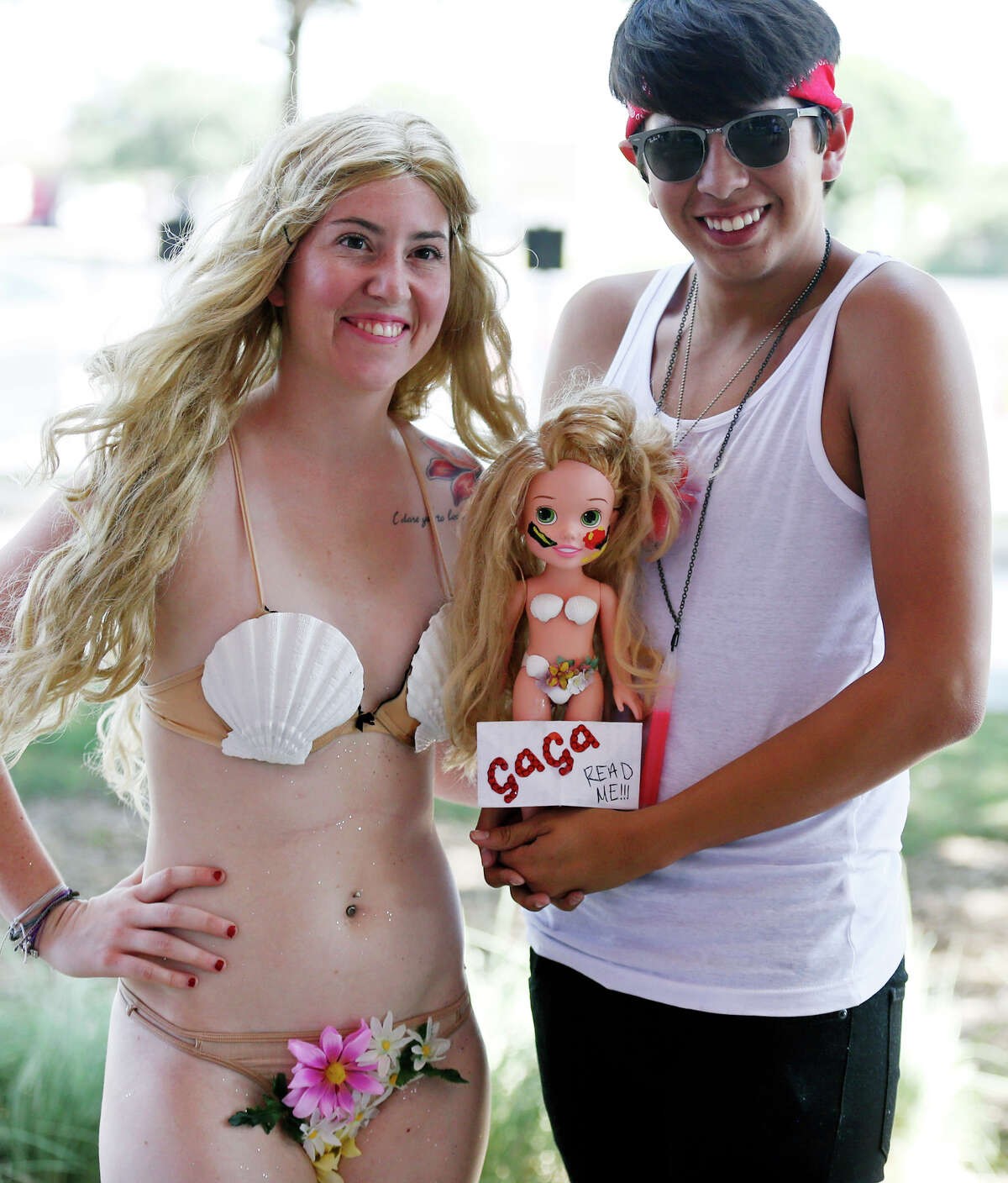 Lady Gaga fans Tiffany Alello (left) and Vincent Rodriguez wait for the concert Monday July 14, 2014 at the AT&T Center.