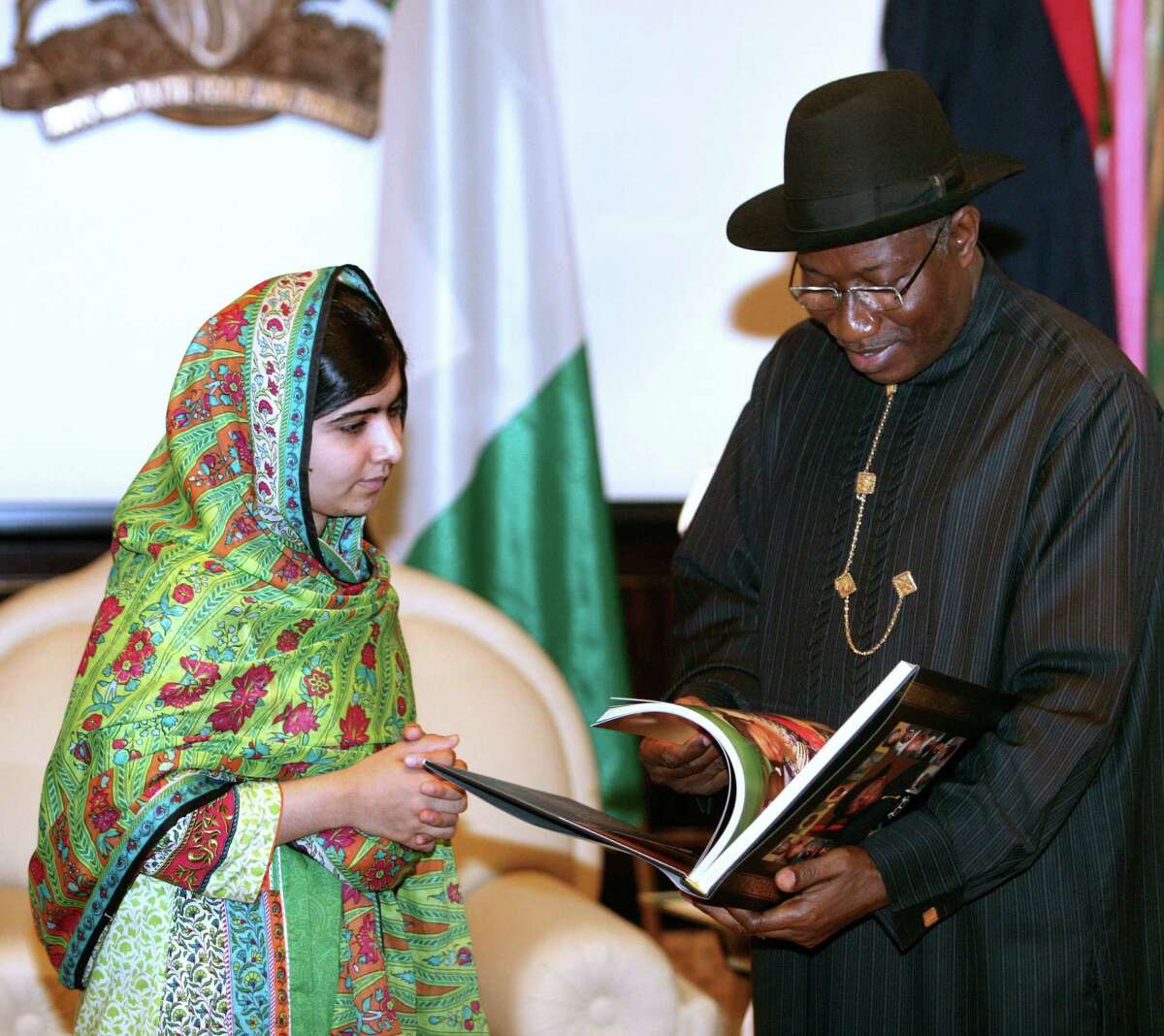 Malala Yousafzai, a Pakistani education and women's rights activist, meets with Nigerian President Goodluck Jonathan. While there, she urged the release of 219 Nigerian schoolgirls.