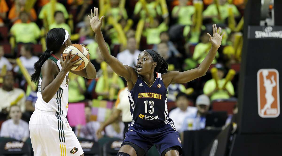 Connecticut Sun's Chiney Ogwumike defends against the Seattle Storm in a WNBA basketball game Tuesday, July 15, 2014, in Seattle. (AP Photo/Elaine Thompson)
