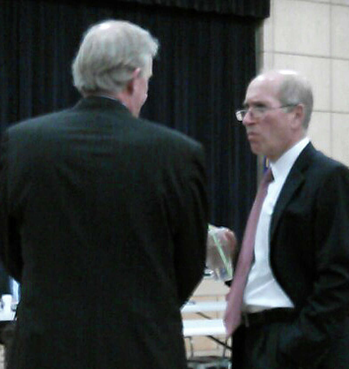 Lawyers representing opposing sides on the application to build 95 apartments on Bronson Road chat on the sidelines of Tuesday's Town Plan and Zoning Commission hearing -- John Fallon, left, represents the developer, and Joel Green argued on behalf of neighborhood oppoents.
