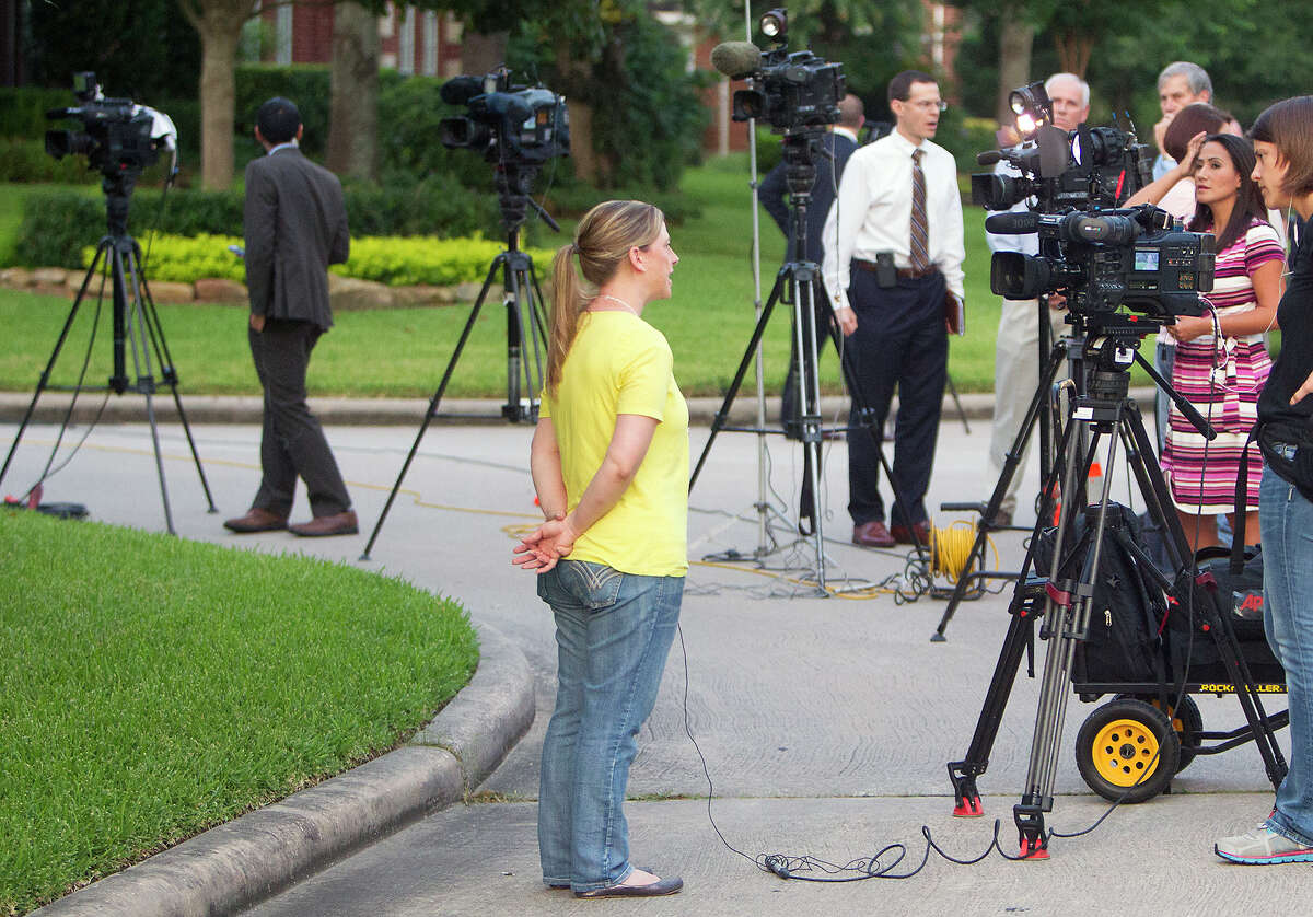 The media interviews Crystal Ross in front of Don Guthrie's home, Wednesday, July 16, 2014, in Spring. Katie Stay was Crystal's best friend.