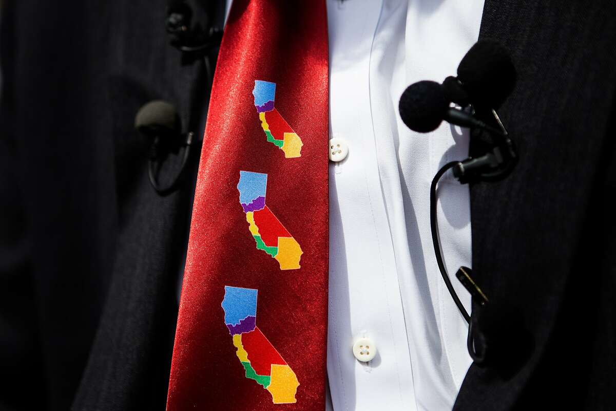 Venture capitalist Tim Draper sports a tie depicting his vision of dividing California into six separate states during a press conference at the County of Sacramento Voter Registration and Elections Department in Sacramento, California, July 15, 2014.