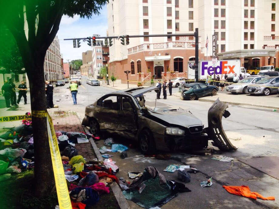 Motorist critical after crashing into truck, car in downtown Albany