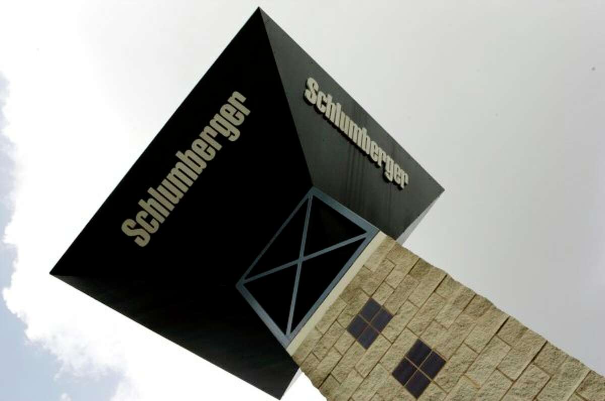 Schlumberger, the world's largest oil field services company, is cutting 9,000 jobs as oil prices plunge. (AP file photo)