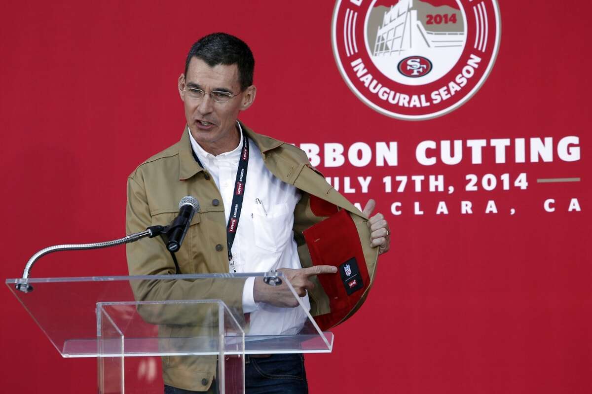 Levi's CEO Chip Bergh points to his 49ers themed Levi's jacket while answering questions before the ribbon cutting ceremony officially opening Levi's Stadium in Santa Clara, CA, Thursday, July 17, 2014.