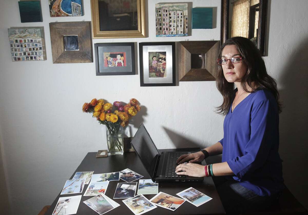 Cory Tschogl, 39, pictured on one of her computers she's been using to deal with her Airbnb eviction situation, surrounded by photos of her Palm Springs home July 17, 2014 in her apartment in San Francisco, Calif. Tschogl, who is a vision rehab therapist, wanted to purchase property, but couldn't afford anything in San Francisco, so she bought a 600 square foot, 1 bedroom place in Palm Springs in May, 2013. She spent about three months working with her father and sister doing interior remodeling work and had the place up on Airbnb by early fall. Her home was reserved by a man and his brother from May 25-July 8, 2014. After staying at her home for 30 days, the client suddenly stopped paying. On the day that the reservation was up, Tschogl sent him a message telling him he had 24 hours to leave before she turned off the power. The man refused to leave and threatened to take legal action against her over various claimed damages, including health problems from drinking the tap water. Because he has been in her home for 30 days, he has tenant rights under California tenant law. Tschogl is now in the eviction process, which could take months and cost her thousands of dollars.