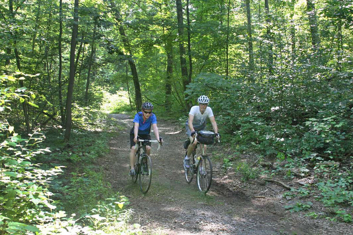 Tom O'Brien and his son, Jake, 16, on a ride together at Sega Meadows Park, in New Milford, Conn. The park trail would be part of the Western New England Greenway, a planned bike trail that would run from Montreal, Canada to Long Island Sound.