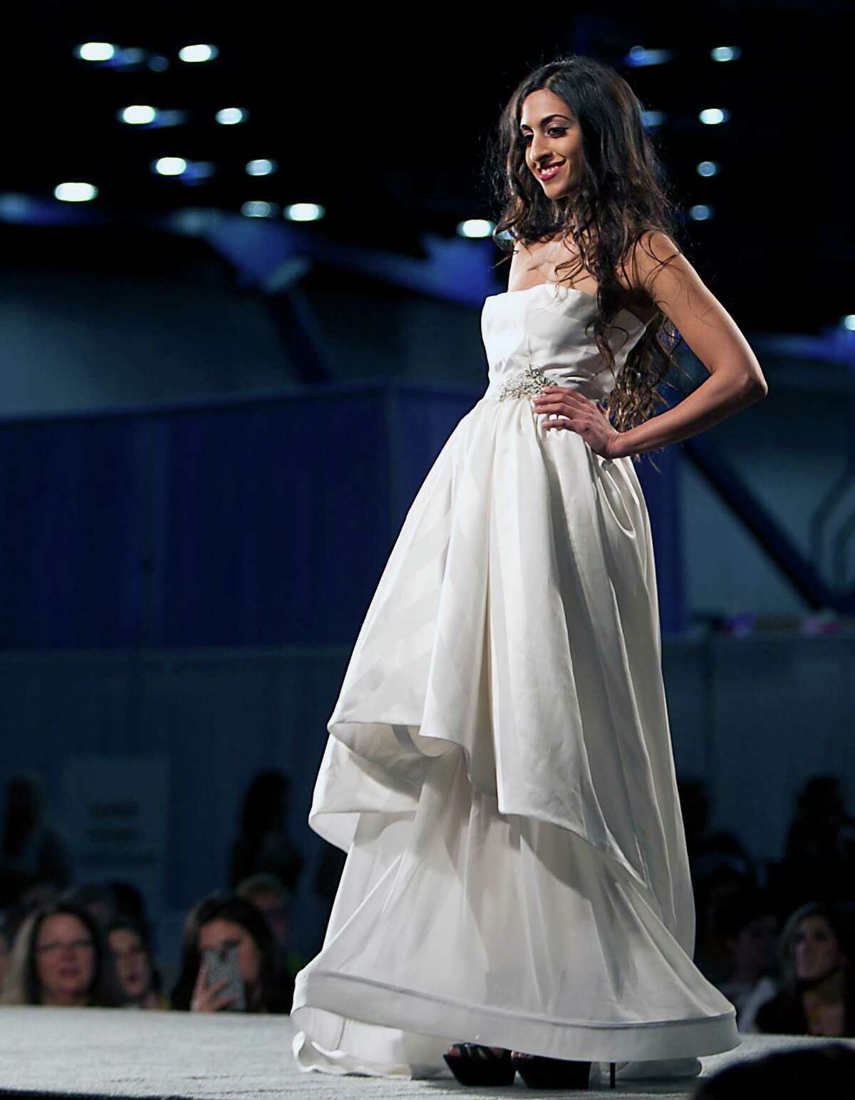 A model walks the runway during the Damsel White Label bridal fashion show at the 30th Bi-Annual Bridal Extravaganza Show at the George R. Brown Convention Center.