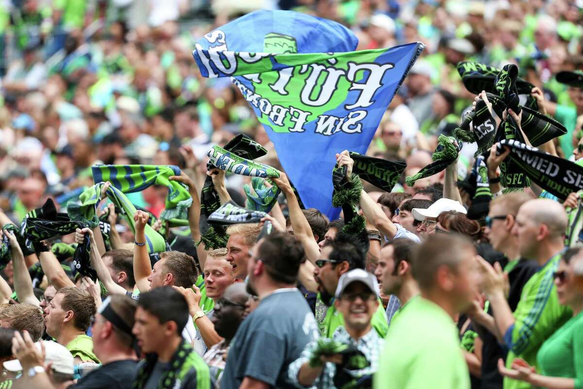 Fans cheer during the Seattle Sounders FC friendly against Tottenham Hotspur.