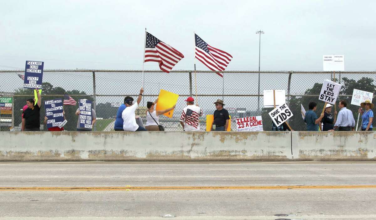 Pro and anti-immigration supporters protest Saturday in Conroe. Immigrant advocates warned that the government may be moving too quickly in deporting some who are fleeing violence in their home countries.