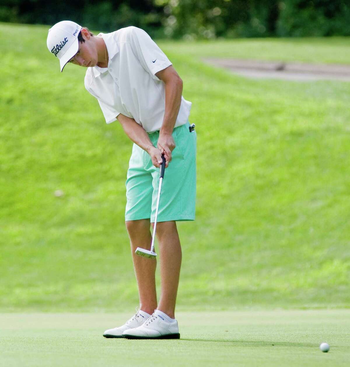 Max Theodorakis putting on the 11th hole at the Danbury Amateur golf tournament at Richter Park. Sunday, July 20, 2014