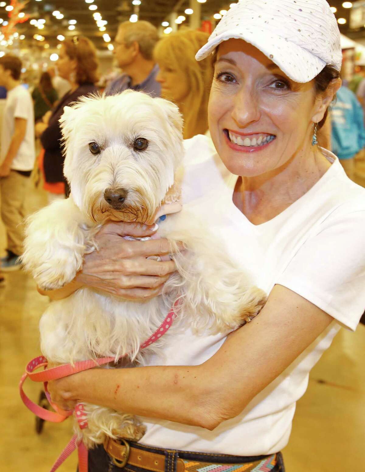 People pose with their dog during the Houston World Series of Dog Shows at NRG Center Sunday, July 20, 2014, in Houston.