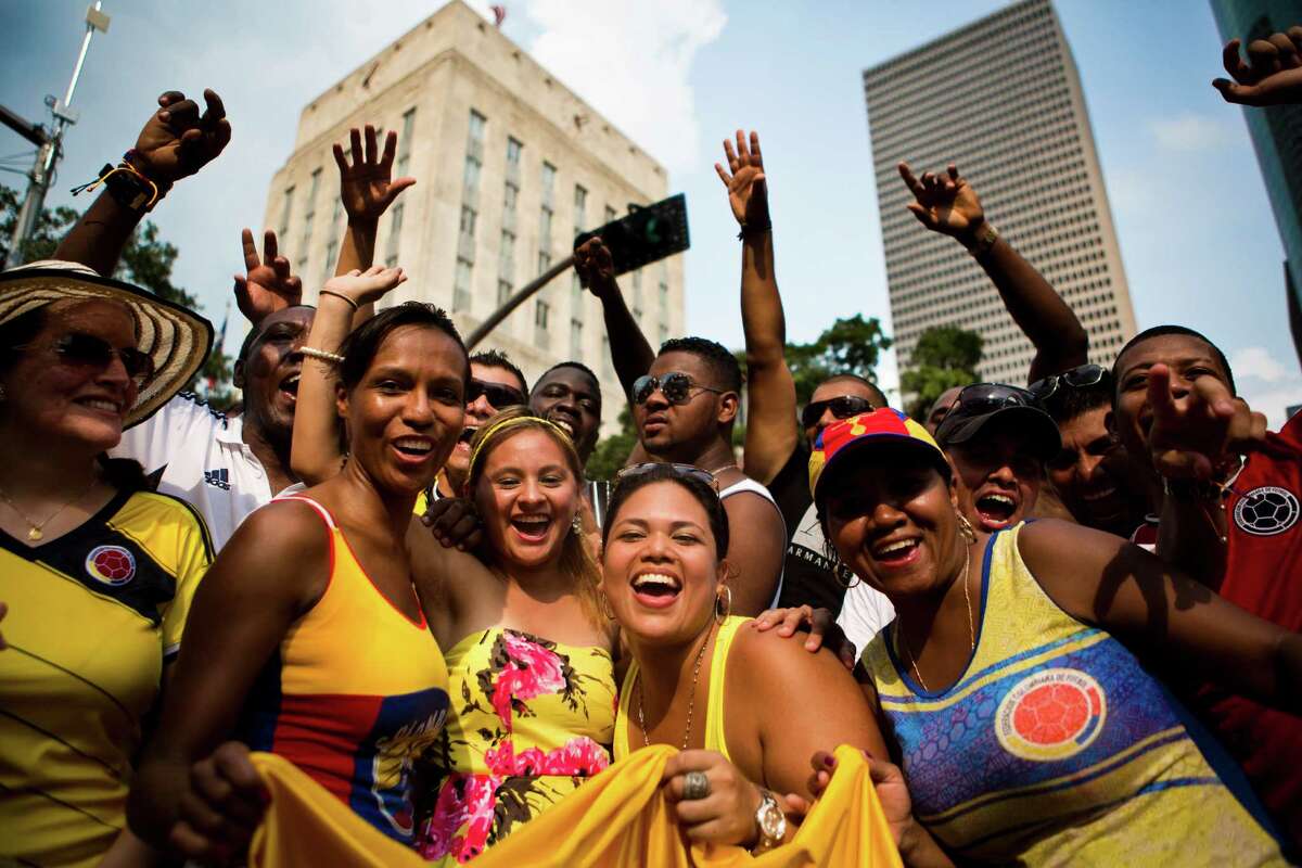 Colombians gathered in mass in Downtown Houston to honor their South American nation and their energetic traditions with music, food and drinks on Sunday, July 20, 2014. David Dorantes describes the jubilant party scene in downtown Houston at LaVozTx.com.Keep clicking to check out more photos from this colorful celebration.