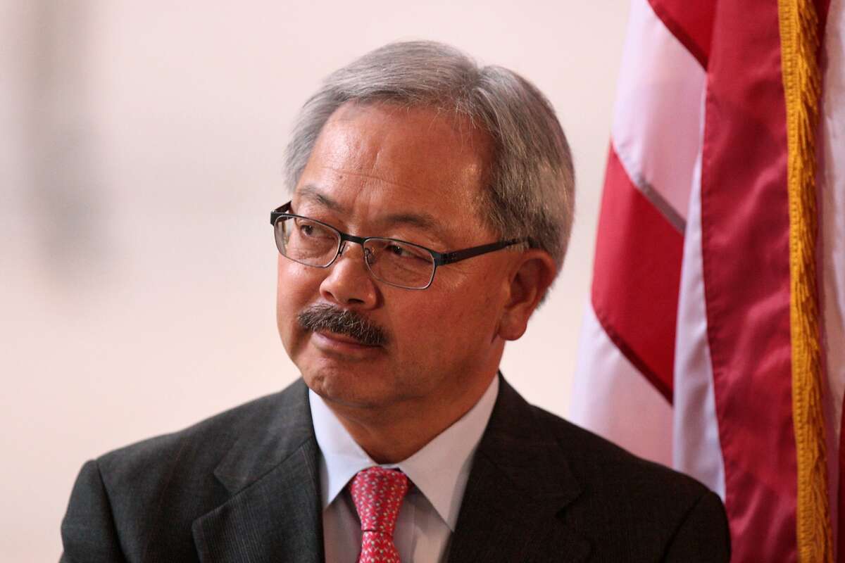 San Francisco Mayor Ed Lee watches PGA Tour Commissioner Tim Finchem speak at a City Hall press conference on Wednesday, July 2, 2014 announcing three high-profile golf events, the 2015 Match Play Championship, the 2020 PGA Championship and the 2025 Presidents Cup, will be coming to TPC Harding Park in San Francisco, Calif.