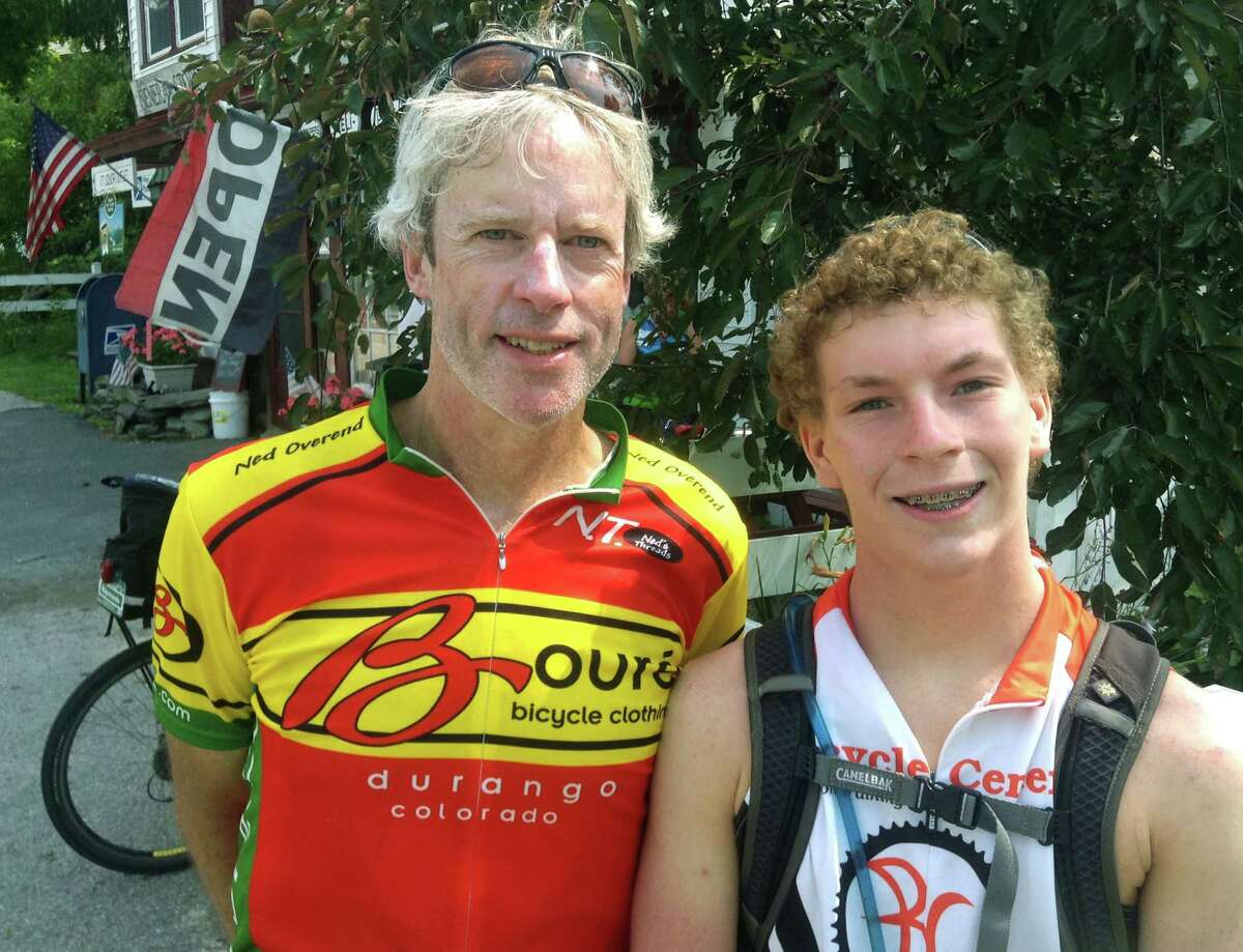 Tom O'Brien and his son, Jake, 16, of New Miilford pose Tuesday, July 22, 2014 at the general store in East Poultney, Vermont for a keepsake photo along their bicycle ride from Burlington to the Long Island Sound. The O'Briens and their fellow cyclists are expected to be in New Milford Friday, July 25 about 4 p.m. before resuming their ride southward along Route 7. Courtesy of Tom O'Brien
